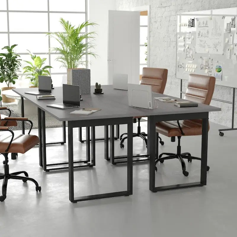 Tavolo da riunione con piano in laminato e base a U